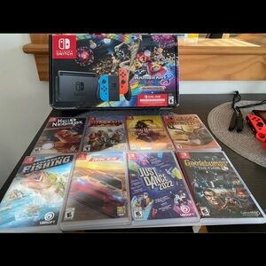 Nintendo Switch with Red and Blue Joy-Con and Game Collection